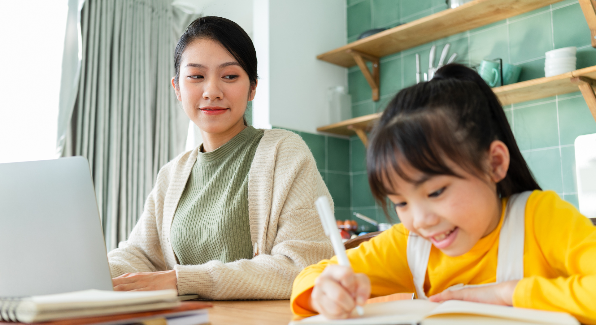 Parent and child studying together at desk with 11+ practice papers and limited time for exam preparation